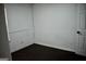 A cozy room featuring dark wood floors and pristine white walls at 3281 Nina Way, Douglasville, GA 30135