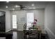 Bright dining area with a ceiling fan, a wooden table with chairs and natural lighting from the backyard door at 3281 Nina Way, Douglasville, GA 30135