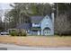 Charming two-story home featuring a classic blue exterior, complemented by a dark roof and a neatly maintained front yard at 3281 Nina Way, Douglasville, GA 30135