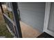 Inviting porch with wood railing and neutral flooring leading to a white front door at 3281 Nina Way, Douglasville, GA 30135
