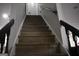 Wooden staircase leading to the upper level of the home at 3281 Nina Way, Douglasville, GA 30135