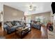 Comfortable living room with plush sofas, a ceiling fan, and a view to the kitchen at 14 Edith Ln, Douglasville, GA 30134