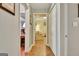 Hallway with tile flooring, leading to a bright living room and offering closet space at 142 Kenton Pl, Peachtree City, GA 30269