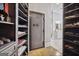 Spacious closet features a large Browning gun safe and custom shelving for storage at 2242 Sxxxx Xxxx Rd, Buford, GA 30518