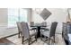 A stylish dining room features modern decor, a round table, and a light fixture at 113 Maplewood Ln # 176, Conyers, GA 30094