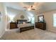 Vaulted ceiling main bedroom with ceiling fan and two dressers at 113 Maplewood Ln # 176, Conyers, GA 30094