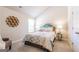 Cozy bedroom with neutral walls, carpet, and decorative wall art above the plush queen bed at 113 Maplewood Ln # 176, Conyers, GA 30094