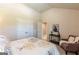 Comfortable bedroom showcasing a decorative console table, arm chair, and double door closet at 113 Maplewood Ln # 176, Conyers, GA 30094