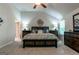 Main bedroom with large bed, ceiling fan, vaulted ceiling, and two dressers at 113 Maplewood Ln # 176, Conyers, GA 30094