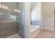 Tiled bathroom showcasing a shower and soaking tub at 113 Maplewood Ln # 176, Conyers, GA 30094
