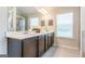 Bathroom featuring a double vanity, soaking tub, separate shower, and natural light at 113 Maplewood Ln # 176, Conyers, GA 30094