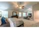 Spacious main bedroom with sitting area, ceiling fan and lots of natural light at 113 Maplewood Ln # 176, Conyers, GA 30094