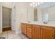 Bathroom with double sink vanity, tile floors and walk-in closet at 243 Long Dr, Mcdonough, GA 30253