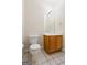 Powder room features tile floors, single vanity and large mirror at 243 Long Dr, Mcdonough, GA 30253