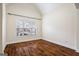 Cozy bedroom with hardwood floors, a window with blinds, and neutral wall color at 243 Long Dr, Mcdonough, GA 30253