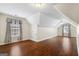 Spacious bedroom with angled ceilings, hardwood floors, and lots of natural light at 243 Long Dr, Mcdonough, GA 30253