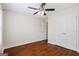 Bedroom with hardwood floors, a ceiling fan, closet space, and lots of natural light at 243 Long Dr, Mcdonough, GA 30253