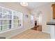 Bright breakfast nook with tile flooring, and views of the back yard and living room at 243 Long Dr, Mcdonough, GA 30253