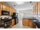 Kitchen with stainless steel appliances, granite countertops, tile backsplash, and wooden cabinets at 243 Long Dr, Mcdonough, GA 30253