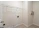 Practical laundry room with shelving and tile floors at 243 Long Dr, Mcdonough, GA 30253