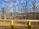 Wooden deck offering tranquil views of the backyard and wooded area at 3382 Milan Ct # 3 Plapprox Sqft 3, Douglasville, GA 30135