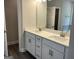 Bathroom with double sink vanity, framed mirror, and plenty of counter space at 3382 Milan Ct # 3 Plapprox Sqft 3, Douglasville, GA 30135
