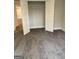 View of bedroom with carpeted flooring and a closet with gray walls, and double doors at 3382 Milan Ct # 3 Plapprox Sqft 3, Douglasville, GA 30135
