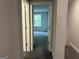View of bedroom through the doorway with gray walls and carpet flooring, and a window that lets in natural light at 3382 Milan Ct # 3 Plapprox Sqft 3, Douglasville, GA 30135
