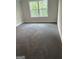 View of bedroom with carpeted flooring, a window that lets in natural light, and light gray walls at 3382 Milan Ct # 3 Plapprox Sqft 3, Douglasville, GA 30135