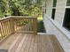New wooden deck offers a serene outdoor space, perfect for relaxation and enjoying the surrounding greenery at 3382 Milan Ct # 3 Plapprox Sqft 3, Douglasville, GA 30135