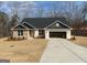 Well-manicured lawn enhances the appeal of this single-story home with a two-car garage and black shingle roof at 3382 Milan Ct # 3 Plapprox Sqft 3, Douglasville, GA 30135