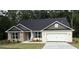 Charming single-story home featuring a stone facade, two-car garage, and well-maintained landscaping at 3382 Milan Ct # 3 Plapprox Sqft 3, Douglasville, GA 30135