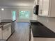 Bright kitchen with stainless appliances, farmhouse sink, white cabinets, and herringbone backsplash at 3382 Milan Ct # 3 Plapprox Sqft 3, Douglasville, GA 30135