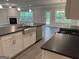Open kitchen featuring large island, stainless steel appliances, and view into living area with fireplace at 3382 Milan Ct # 3 Plapprox Sqft 3, Douglasville, GA 30135