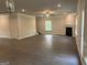 Expansive living room with hardwood floors, fireplace, and stairs to the upper level at 3382 Milan Ct # 3 Plapprox Sqft 3, Douglasville, GA 30135