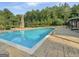 Large swimming pool surrounded by stone patio and wood pergola, perfect for outdoor enjoyment at 3382 Milan Ct # 3 Plapprox Sqft 3, Douglasville, GA 30135