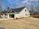 Side view of house with attached two-car garage, brick facade and a dark roof at 3382 Milan Ct # 3 Plapprox Sqft 3, Douglasville, GA 30135