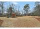 Large backyard featuring a wooden play set, a full fence, and lots of room at 20 Manor Oak Ln, Covington, GA 30014