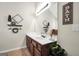 Bathroom featuring a large mirror, white countertop, and stylish decor for a clean and modern look at 20 Manor Oak Ln, Covington, GA 30014