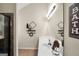 Bathroom with a white single sink vanity and decorative accents creating a refreshing space at 20 Manor Oak Ln, Covington, GA 30014