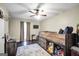 Cozy bedroom with wood flooring, a ceiling fan, and built-in bunk beds at 20 Manor Oak Ln, Covington, GA 30014