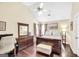 A well-lit bedroom with neutral walls, a ceiling fan and ample storage space at 20 Manor Oak Ln, Covington, GA 30014