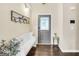 Welcoming foyer with decorative door, bench, and coat rack creating a charming entryway at 20 Manor Oak Ln, Covington, GA 30014