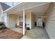 Inviting covered front porch with bench seating, creating a cozy entrance to the home at 20 Manor Oak Ln, Covington, GA 30014