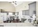 Spacious kitchen with sleek gray cabinets, a white refrigerator, and open layout, perfect for entertaining at 20 Manor Oak Ln, Covington, GA 30014