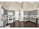 Bright kitchen featuring gray cabinets, stainless steel appliances, and ample counter space at 20 Manor Oak Ln, Covington, GA 30014