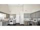 Bright kitchen featuring gray cabinetry, subway tile backsplash, and modern appliances at 20 Manor Oak Ln, Covington, GA 30014