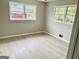 Bright bedroom with hardwood floors and two windows providing natural light at 2037 Mesa Se Dr, Atlanta, GA 30316