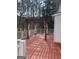 Outdoor deck featuring wood flooring, pergola with curtains, and white railings at 57 Kristina Ct, Acworth, GA 30101