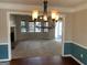 Dining room with a view into the living room with a fireplace and carpet at 57 Kristina Ct, Acworth, GA 30101